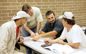 A group of adult education students studying together.