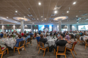 Wide view of the luncheon space with attendees gathered to celebrate literacy and community impact.