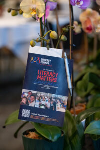 Wide view of the luncheon space with attendees gathered to celebrate literacy and community impact.