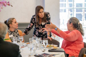Attendees engaged in conversation during the Literacy Matters wine reception
