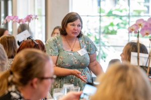Attendees engaged in conversation during the Literacy Matters wine reception