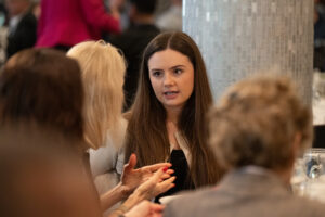 Attendees engaged in conversation during the Literacy Matters wine reception