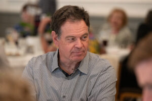 Attendees engaged in conversation during the Literacy Matters wine reception