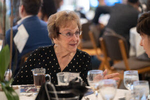 Attendees engaged in conversation during the Literacy Matters wine reception