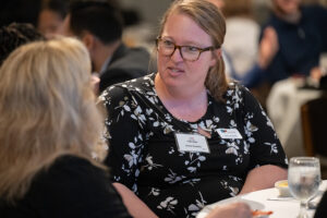 Attendees engaged in conversation during the Literacy Matters wine reception