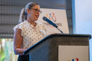 Presenter delivering remarks during the Literacy Matters Luncheon while audience listens attentively.
