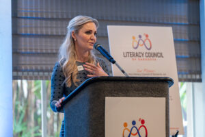 Guest speaker Jessica Muroff addressing attendees from the stage at the Literacy Matters 2026 Luncheon.