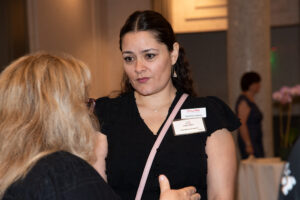 Attendees engaged in conversation during the Literacy Matters wine reception.