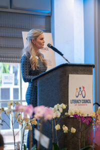 Guest speaker Jessica Muroff addressing attendees from the stage at the Literacy Matters 2026 Luncheon.