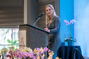 Guest speaker Jessica Muroff addressing attendees from the stage at the Literacy Matters 2026 Luncheon.