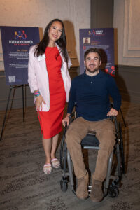 Two attendees smiling and posing together at the Literacy Matters Luncheon.