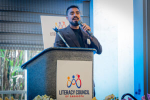 ide view of the luncheon space with attendees gathered to celebrate literacy and community impact.