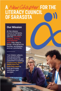 Poster titled “A New Chapter for the Literacy Council of Sarasota” featuring two adults smiling and working together at a computer. A mission statement explains the organization empowers adults with essential reading, writing, and language skills to strengthen families, workplaces, and the community.